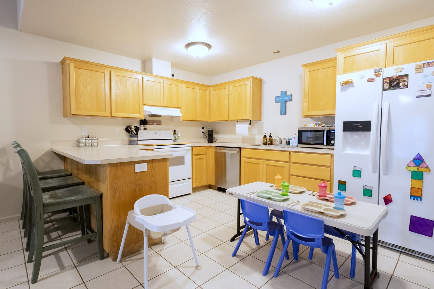 Open kitchen with the children’s dining table set for a meal
