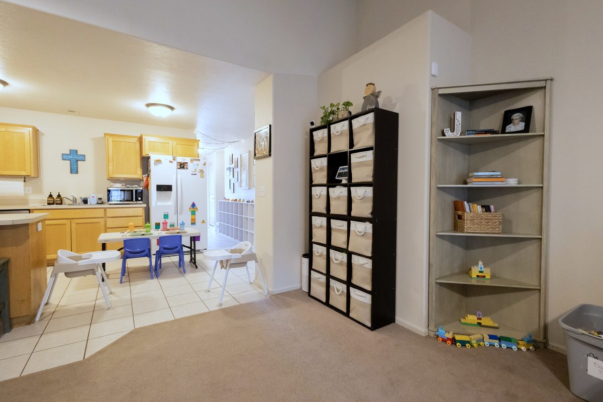 Kitchen opening onto the children’s table and storage shelves