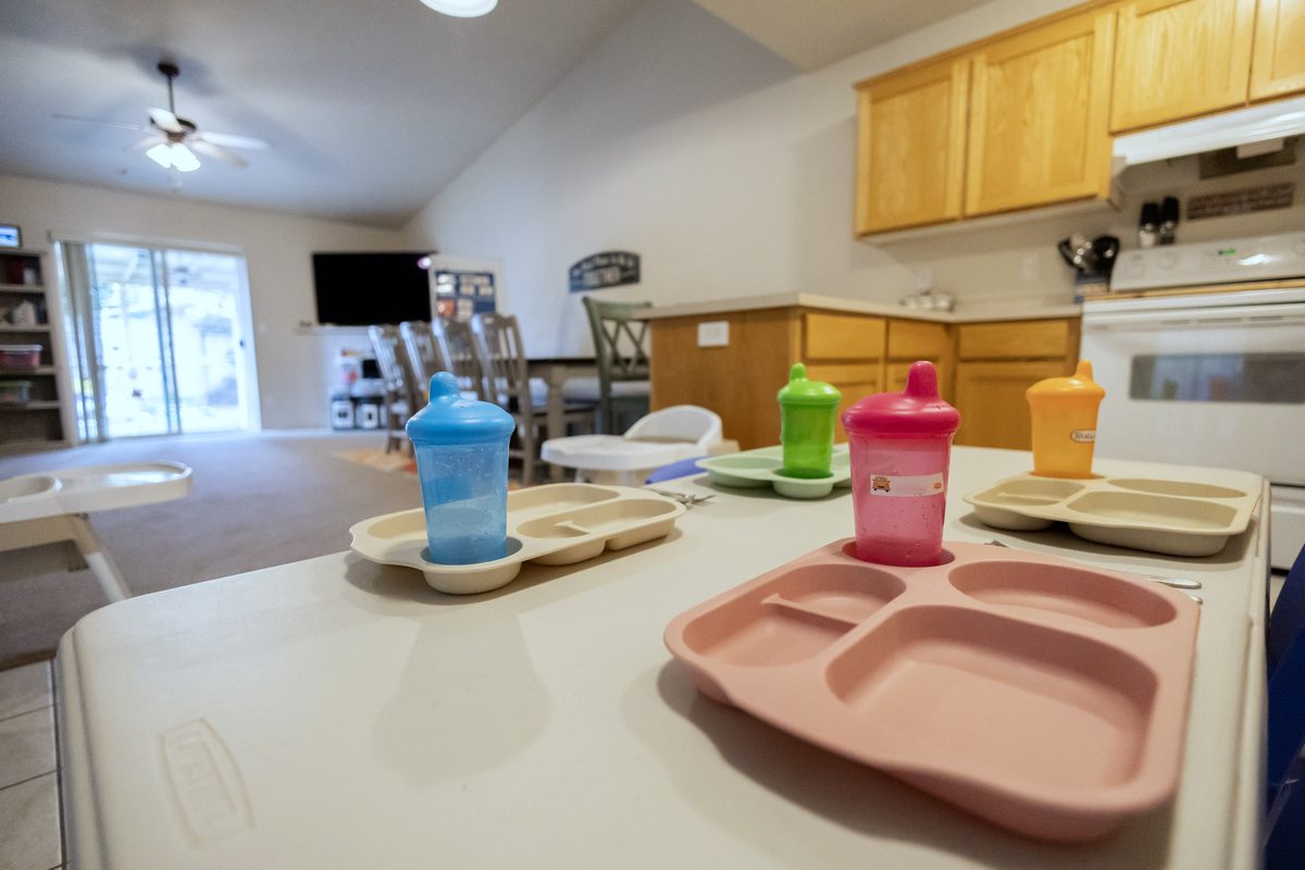 Table set with divided trays and cups for lunch